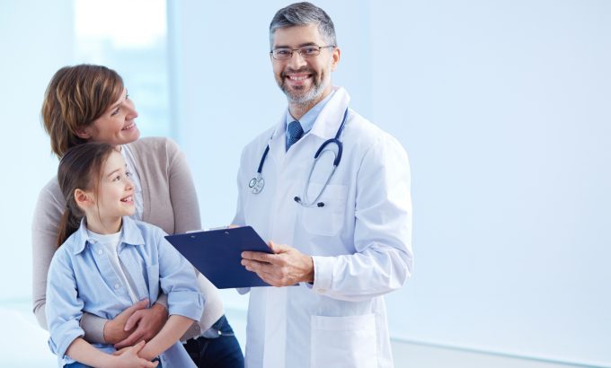 happy-doctor-holding-clipboard-with-patients